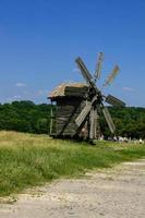 Wooden windmills in the village photo