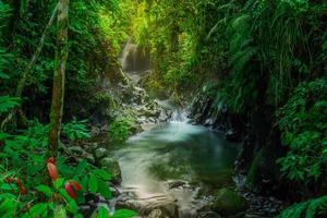 morning view in Indonesia with a beautiful waterfall in the morning photo