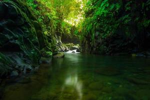 morning view in Indonesia with a beautiful waterfall in the morning photo