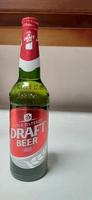 Magelang, Central Java, Indonesia, 2022 - A fully filled cold filtered Draft Beer on a white table photo