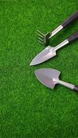 Graden tools set on green grass photo