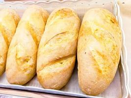 French breads on the shelves sold in the bakery. photo