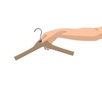 Woman's hand with clothes hanger vector