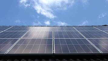 Time lapse of solar panels producing clean energy on a roof of a residential house. video