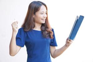 Businesswoman looking at a portable computer monitor Glad to have more profit photo