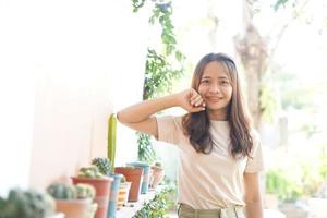 Asian woman smiling happily in a cafe photo