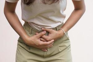 Woman suffer from stomachacheChronic gastritis Abdomen bloating concept photo