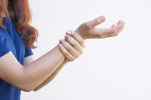 Asian female hands have weakness from office work photo