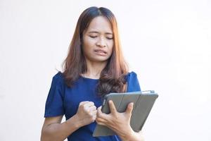Businesswoman looking at laptop computer screen desperately losing business photo