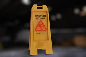 Sign yellow showing warning of caution wet floor wet floor sign on factory of falling person Caution wet floor Sign showing warning of wet floor photo