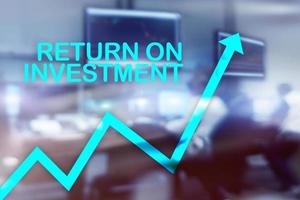 ROI - Return on investment. Stock trading and financial growth concept on blurred business center background. photo