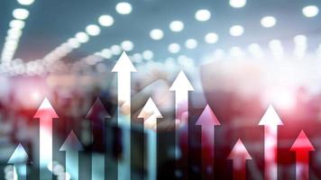 Up arrow graph on skyscraper background. Invesment and financial growth concept. photo