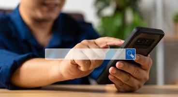 Businessman using a smartphone for searching information on the internet, searching browsing internet bar, Concept of Searching Browsing Internet Data Information Networking photo