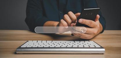 Businessman using a smartphone for searching information on the internet, searching browsing internet bar, Concept of Searching Browsing Internet Data Information Networking photo