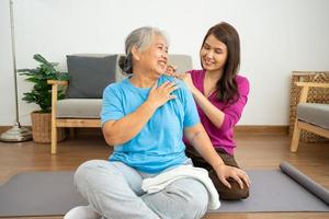 Asian careful caregiver or nurse taking care of the patient in a home.  Concept of happy retirement with care from a caregiver and Savings and senior health insurance, a Happy Family photo
