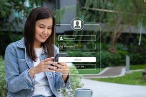 Woman using smartphones to type user and passwords for login financial applications,  identification information security, and encryption, Concept of Cyber security for internet access photo