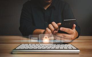 Asian Businessman typing username and password for unlock network connections before assigning bank accounts, credit card, and confidential data. Cyber security internet and networking concept photo