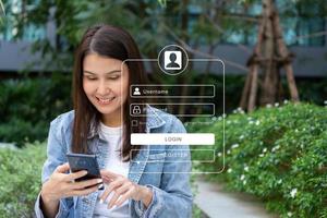 Woman using smartphones to type user and passwords for login financial applications,  identification information security, and encryption, Concept of Cyber security for internet access photo