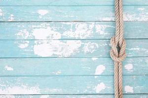 pattern rope on a blue old wooden background. Top view. Leave a copy space for writing descriptive photo