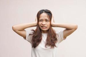 Asian women suffer from work stress. Put your hand on your head photo