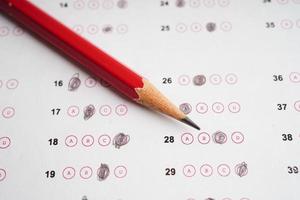 Answer sheets with pencil drawing fill to select choice, education concept. photo