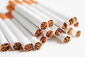 Cigarette, roll tobacco in paper with filter tube, No smoking concept. photo