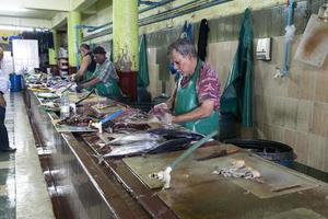 MALE, MALDIVES - FEBRUARY, 23 2019 - People buying at fish market photo