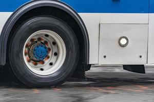 coach bus tire detail while raining in new york photo
