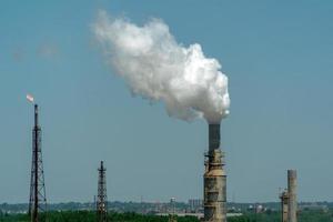 oil refinery smoking chimney detail photo