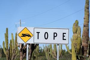 mexico tope sign in english bump road sign photo