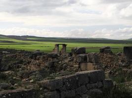 Volubilis Roman ruins in Morocco- Best-preserved Roman ruins located between the Imperial Cities of Fez and Meknes photo