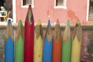 giant colourful pencils fence in venice chioggia photo