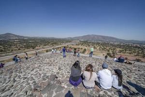 MEXICO CITY, MEXICO - JANUARY 30 2019 - Tourist climbing Teotihuacan pyramid mexico photo