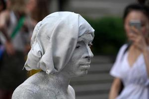 NEW YORK, USA - MAY 27 2018 - living statue performer outside Met photo