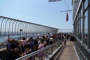 NEW YORK, USA - MAY 25 2018 - Empire state building crowded of tourists photo