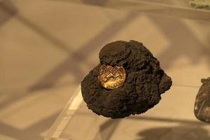 ERCOLANO, ITALY - FEBRUARY 2 2020 - Ercolano Herculaneum ancient ruins gold  exhibit photo