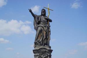 Prague charles bridge detail of statue photo