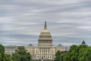 Washington DC Capitol from the mall on cloudy sky background photo