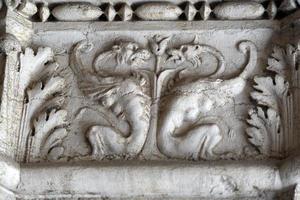 VENICE, ITALY - SEPTEMBER 15 2019 - doge ducal palace capital of column wayside sculpture detail photo