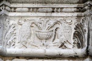 VENICE, ITALY - SEPTEMBER 15 2019 - doge ducal palace capital of column wayside sculpture detail photo