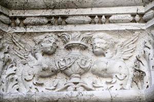 VENICE, ITALY - SEPTEMBER 15 2019 - doge ducal palace capital of column wayside sculpture detail photo