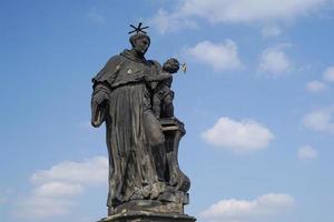 Prague charles bridge detail of statue photo