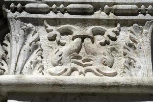 VENICE, ITALY - SEPTEMBER 15 2019 - doge ducal palace capital of column wayside sculpture detail photo