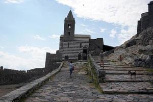 PORTOVENERE, ITALY - SEPTEMBER 24 2017 - Many Tourists in pictoresque italian village photo