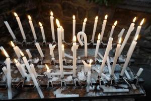 church votive candles white flames photo