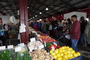 MELBOURNE, AUSTRALIA - AUGUST 15 2017 - People buying at the market photo