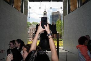 PHILADELPHIA, USA - MAY 23 2018 - Visitors at Liberty Bell photo