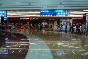 DUBAI, UAE - AUGUST 14 2017 - Travellers at Dubai Airport photo