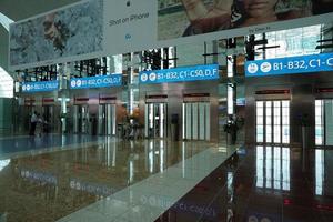 DUBAI, UAE - AUGUST 14 2017 - Travellers at Dubai Airport photo