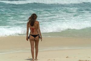 beautiful girl on tropical sandy beach photo